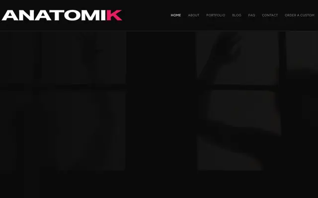 Anatomik Media home page, a custom porn studio, with its menu over a dark banner